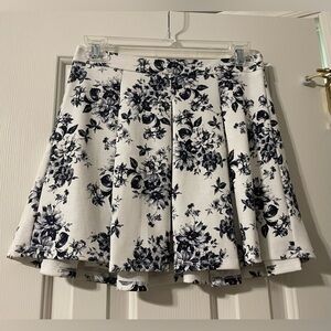 White mini skirt with blue flower detail. Size small